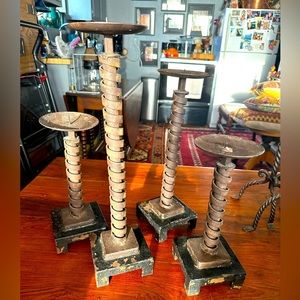 Wrought iron candle holders sold individually. I bought them in SoHo NYC. Heavy